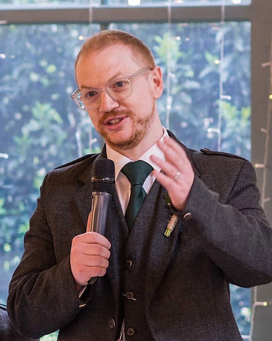 Michael, founder of The Doing Coach, speaking to a room
